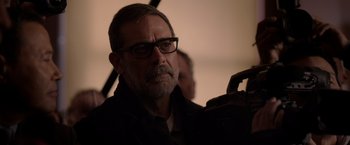 Movie still from “The Unholy” (2021), directed by Evan Spiliotopoulos – A person wearing glasses and a jacket; Close Up shot, Over the shoulder angle