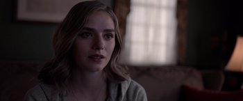 Movie still from “The Unholy” (2021), directed by Evan Spiliotopoulos – A person wearing a sweater; Close Up shot, Over the shoulder angle