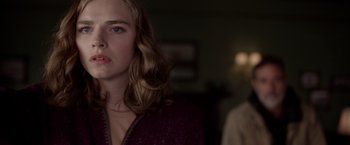 Movie still from “The Unholy” (2021), directed by Evan Spiliotopoulos – A woman with long blonde hair standing next to a man; Close Up shot, Over the shoulder angle