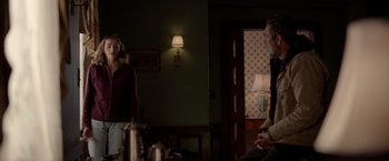 Movie still from “The Unholy” (2021), directed by Evan Spiliotopoulos – Two people are sitting in a living room; Medium shot, Over the shoulder angle