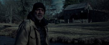 Movie still from “The Unholy” (2021), directed by Evan Spiliotopoulos – An older man standing in front of a barn; Medium shot, Over the shoulder angle