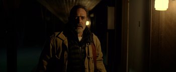 Movie still from “The Unholy” (2021), directed by Evan Spiliotopoulos – A man with a beard wearing a jacket; Close Up shot, Over the shoulder angle