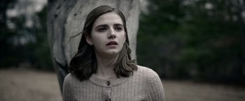 Movie still from “The Unholy” (2021), directed by Evan Spiliotopoulos – A young woman with long hair is standing in front of a tree; Close Up shot, Low angle