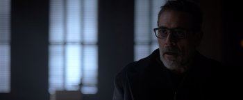 Movie still from “The Unholy” (2021), directed by Evan Spiliotopoulos – A person wearing glasses and a coat; Close Up shot, Over the shoulder angle