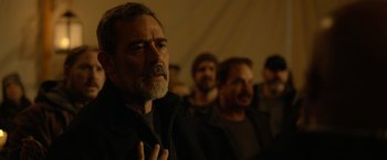 Movie still from “The Unholy” (2021), directed by Evan Spiliotopoulos – A group of men standing next to each other in a room; Close Up shot, Over the shoulder angle