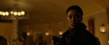 Movie still from “The Unholy” (2021), directed by Evan Spiliotopoulos – A woman in a black jacket looking into the camera; Close Up shot, Over the shoulder angle