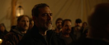 Movie still from “The Unholy” (2021), directed by Evan Spiliotopoulos – A group of people standing in a room; Close Up shot, Over the shoulder angle