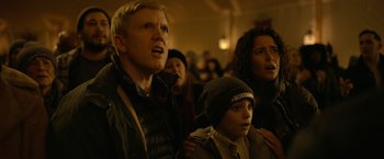 Movie still from “The Unholy” (2021), directed by Evan Spiliotopoulos – A group of people standing in front of a crowd; Close Up shot, Low angle