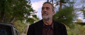 Movie still from “The Unholy” (2021), directed by Evan Spiliotopoulos – A person with a beard wearing a jacket; Close Up shot, Low angle