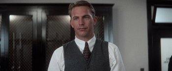 Movie still from “The Untouchables” (1987), directed by Brian De Palma – A person wearing a vest and a tie; Close Up shot, Low angle