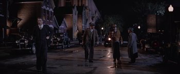 Movie still from “The Untouchables” (1987), directed by Brian De Palma – A couple of men walking down a street at night; Wide shot, Low angle