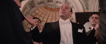 Movie still from “The Untouchables” (1987), directed by Brian De Palma – A man in a black suit and a white bow tie; Close Up shot, Low angle