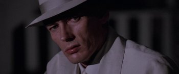 Movie still from “The Untouchables” (1987), directed by Brian De Palma – A person wearing a hat; Close Up shot, High angle