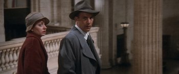 Movie still from “The Untouchables” (1987), directed by Brian De Palma – A man wearing a hat and a suit; Medium shot, Low angle
