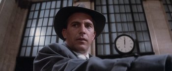 Movie still from “The Untouchables” (1987), directed by Brian De Palma – A man wearing a hat and a suit and tie; Close Up shot, Low angle