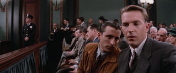 Movie still from “The Untouchables” (1987), directed by Brian De Palma – A group of men sitting next to each other in a room; Close Up shot, Low angle