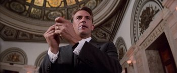 Movie still from “The Untouchables” (1987), directed by Brian De Palma – A person wearing a suit and tie; Close Up shot, Low angle