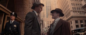 Movie still from “The Untouchables” (1987), directed by Brian De Palma – A couple of men standing next to each other on a street; Medium shot, Low angle