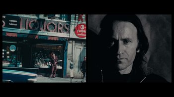 Movie still from “The Velvet Underground” (2021), directed by Todd Haynes – Two pictures of a man in front of a store; Close Up shot, Low angle