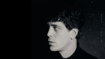 Movie still from “The Velvet Underground” (2021), directed by Todd Haynes – A black - and - white photo of a man's face; Close Up shot, Low angle