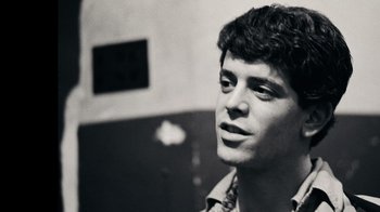 Movie still from “The Velvet Underground” (2021), directed by Todd Haynes – Black and white photograph of a young man looking up; Close Up shot, Low angle