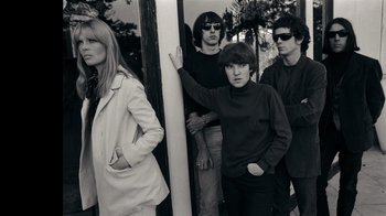 Movie still from “The Velvet Underground” (2021), directed by Todd Haynes – A black and white photo of a group of young people; Medium shot, Low angle