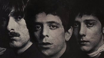 Movie still from “The Velvet Underground” (2021), directed by Todd Haynes – A black and white photo of a man's face; Extreme Close Up shot, Low angle