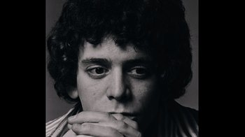 Movie still from “The Velvet Underground” (2021), directed by Todd Haynes – Black and white photograph of a man with curly hair; Close Up shot, Low angle