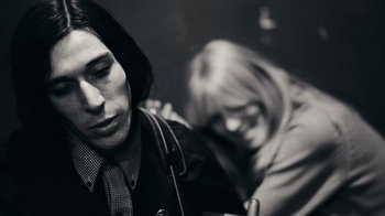 Movie still from “The Velvet Underground” (2021), directed by Todd Haynes – A man and a woman sitting next to each other; Close Up shot, Low angle