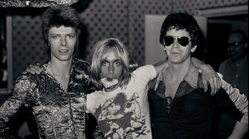 Movie still from “The Velvet Underground” (2021), directed by Todd Haynes – A black and white photo of a group of people; Medium shot, Low angle