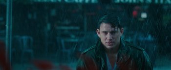 Movie still from “The Vow” (2012), directed by Michael Sucsy – A man in a jacket is standing in the rain; Close Up shot, Over the shoulder angle