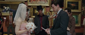 Movie still from “The Vow” (2012), directed by Michael Sucsy – A bride and groom exchanging their wedding vows in front of two other people; Medium shot, Over the shoulder angle