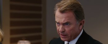 Movie still from “The Vow” (2012), directed by Michael Sucsy – A man in a suit and tie looking to his left; Close Up shot, Over the shoulder angle