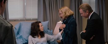 Movie still from “The Vow” (2012), directed by Michael Sucsy – Two women in a room with a lamp on the wall; Medium shot, Over the shoulder angle