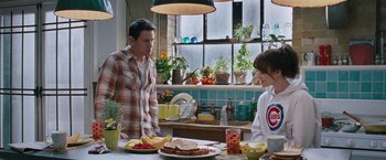 Movie still from “The Vow” (2012), directed by Michael Sucsy – A man and a woman standing at a table in a kitchen; Medium shot, Over the shoulder angle