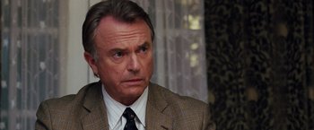 Movie still from “The Vow” (2012), directed by Michael Sucsy – An older man in a suit and tie looking to his left; Close Up shot, Over the shoulder angle