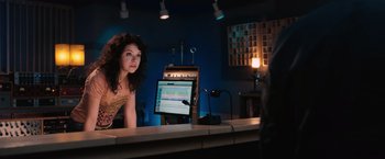 Movie still from “The Vow” (2012), directed by Michael Sucsy – A woman sitting in front of a computer monitor; Medium shot, Over the shoulder angle