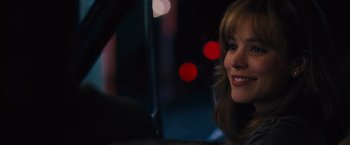 Movie still from “The Vow” (2012), directed by Michael Sucsy – A woman sitting in a car at night with lights in the background; Close Up shot, Over the shoulder angle