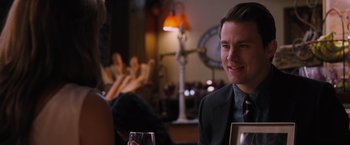 Movie still from “The Vow” (2012), directed by Michael Sucsy – A man sitting at a table with a glass of wine in front of him; Close Up shot, Over the shoulder angle