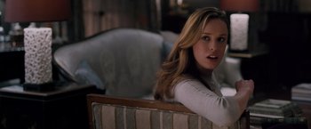 Movie still from “The Vow” (2012), directed by Michael Sucsy – A beautiful young woman sitting on a couch; Close Up shot, Over the shoulder angle