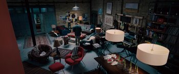 Movie still from “The Vow” (2012), directed by Michael Sucsy – A living room filled with lots of furniture and lamps; Wide shot, Overhead angle