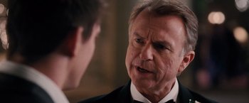 Movie still from “The Vow” (2012), directed by Michael Sucsy – An older man wearing a tuxedo talking to a younger man; Close Up shot, Over the shoulder angle