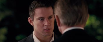Movie still from “The Vow” (2012), directed by Michael Sucsy – A man in a business suit talking to another man in a business suit; Close Up shot, Over the shoulder angle