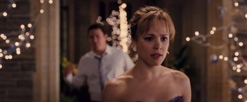 Movie still from “The Vow” (2012), directed by Michael Sucsy – A woman in a strapless dress looking at the camera; Close Up shot, Over the shoulder angle