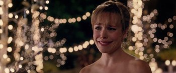 Movie still from “The Vow” (2012), directed by Michael Sucsy – A person smiling with lights in the background; Close Up shot, Over the shoulder angle