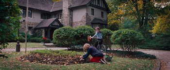 Movie still from “The Vow” (2012), directed by Michael Sucsy – Two children playing in the yard with a bicycle; Wide shot, High angle