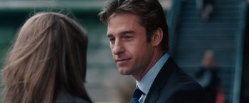 Movie still from “The Vow” (2012), directed by Michael Sucsy – A man in a suit and tie looking to his left; Close Up shot, Over the shoulder angle