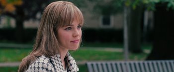 Movie still from “The Vow” (2012), directed by Michael Sucsy – A young woman sitting on top of a park bench; Close Up shot, Over the shoulder angle