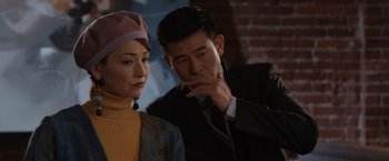 A man and a woman standing next to each other