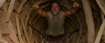 Movie still from “The Water Diviner” (2014), directed by Russell Crowe – A man in a cave with his mouth wide open; Medium shot, Low angle